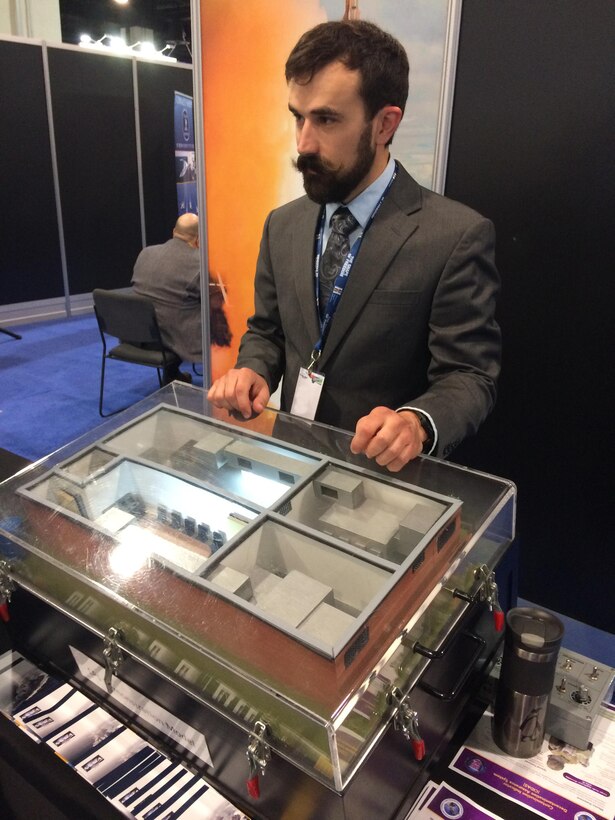 Mr. Kurt Miller discusses with visitors a model of a NSWC Dahlgren Division developed system used in the defense against chemical attack. Dahlgren engineers took part in the Navy League's Sea, Air and Space Symposium 2017, April 2-5, at the National Harbor in Washington, D.C. The Navy League's Sea-Air-Space Exposition brings the U.S. defense industrial base, private-sector U.S. companies and key military decision makers together for an annual innovative, educational, professional and maritime based event. 