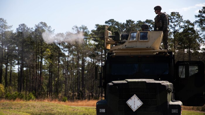 Cpl. Zachary Taylor instructs a Marine on how to use an M2 Browning .50-caliber machine gun at Marine Corps Base Camp Lejeune, N.C., March 30, 2017. The Marines conducted a live-fire from the turrets of Medium Tactical Vehicle Replacement trucks, as part of a culminating event for the Combat Logistics Regiment 25 Command Post Exercise. Taylor is with the Battle Skills Training School, 2nd Marine Logistics Group. 