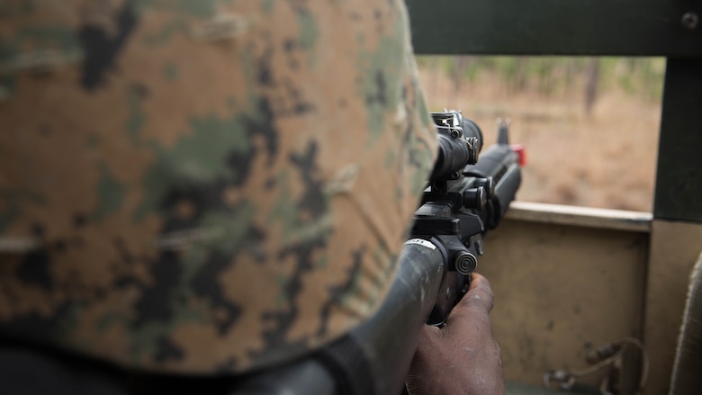 Lance Cpl. Treston Shepherd prepares to engage simulated enemies on the bed of a Medium Tactical Vehicle Replacement truck at Marine Corps Base Camp Lejeune, N.C., March 29, 2017. The Marines conducted a combat convoy exercise as part of the Combat Logistics Regiment 25 Command Post Exercise. Shepherd is with CLR-25, 2nd Marine Logistics Group.