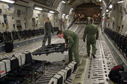 Staff Sgt. Lee Hiott, a loadmaster assigned to the 701st Airlift Squadron, Joint Base Charleston, South Carolina, prepares the aircraft by installing center-row seating prior to departing Charleston to conduct airdrop training with the Wings of Blue parachute team. Citizen Airmen from the 701st Airlift Squadron conducted airdrop training with the Wings of Blue, the U.S. Air Force's parachute jump team, April 1, 2017 in Phoenix, Ariz. (U.S. Air Force photo by TSgt. Bobby Pilch)