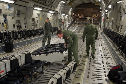 Staff Sgt. Lee Hiott, a loadmaster assigned to the 701st Airlift Squadron, Joint Base Charleston, South Carolina, prepares the aircraft by installing center-row seating prior to departing Charleston to conduct airdrop training with the Wings of Blue parachute team. Citizen Airmen from the 701st Airlift Squadron conducted airdrop training with the Wings of Blue, the U.S. Air Force's parachute jump team, April 1, 2017 in Phoenix, Ariz. (U.S. Air Force photo by TSgt. Bobby Pilch)