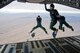 Members from the Wings of Blue and Wings of Green parachute team, depart a Charleston-based C-17 aircraft during their Spring Break training exercise over the Arizona desert. Citizen Airmen from the 701st Airlift Squadron conducted airdrop training with the Wings of Blue, the U.S. Air Force's parachute team, April 1, 2017 in Phoenix, Ariz. (U.S. Air Force photo by TSgt. Bobby Pilch)