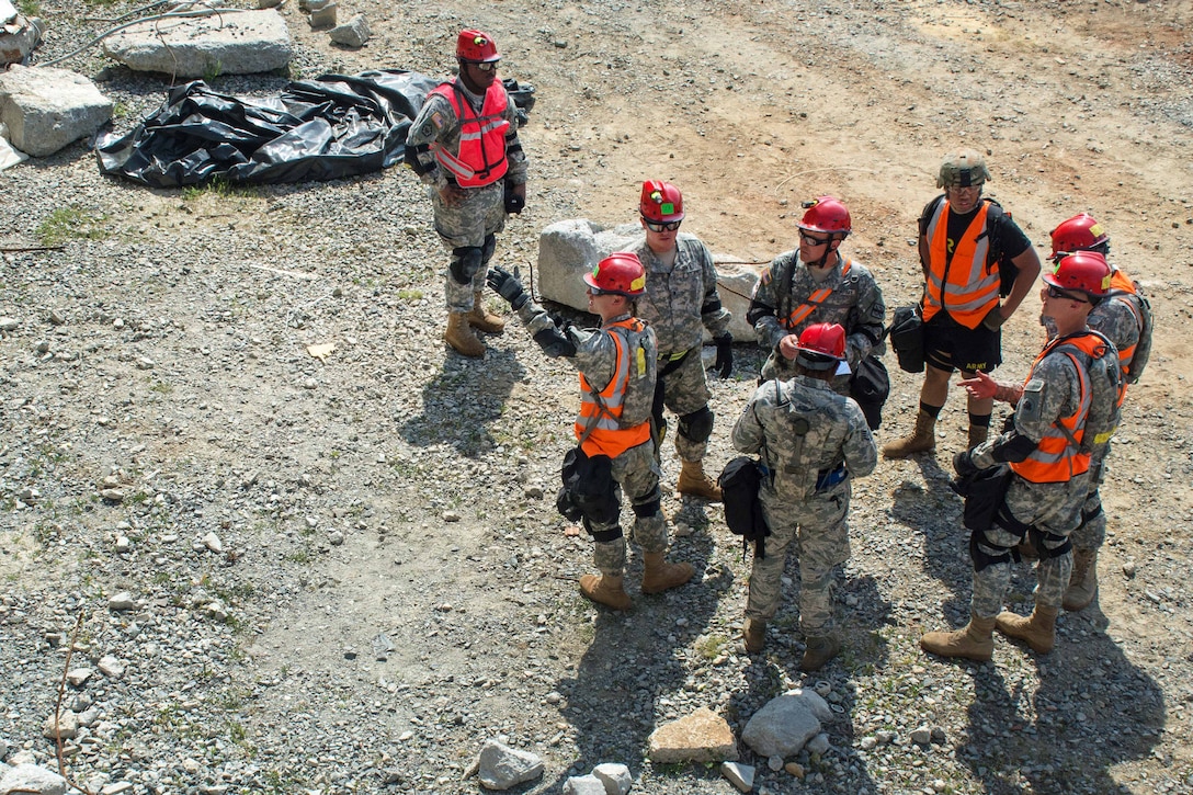 Georgia Army National Guard members receive a mission brief before they reconnoiter a collapsed building during Operation Vigilant Guard at the Guardian Center in Perry, Georgia, March 29, 2017. The Guard members are assigned to the Georgia Army National Guard’s 810th Engineer Company (Sapper). Army photo by Pfc. Darion Gibson