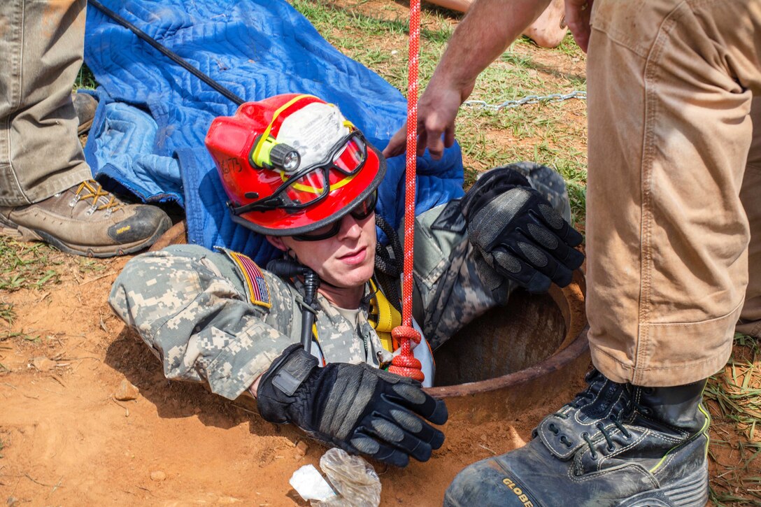 Georgia Army National Guard Sgt. Joshua Crosby climbs out of a manhole during Operation Vigilant Guard at the Guardian Center in Perry, Georgia, March 29, 2017. Crosby is assigned to the Georgia Army National Guard’s 810th Engineer Company (Sapper). Army photo by Pfc. Darion Gibson