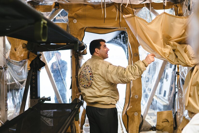 A congressional staff member tours the Transportation Isolation System aboard a C-17 Globemaster III static display Joint Base Andrews, Md., March 31, 2017. The TIS would aid in removing joint service members from harm’s way should a worst-case scenario outbreak occur. (U.S. Air Force photo by Senior Airman Delano Scott)