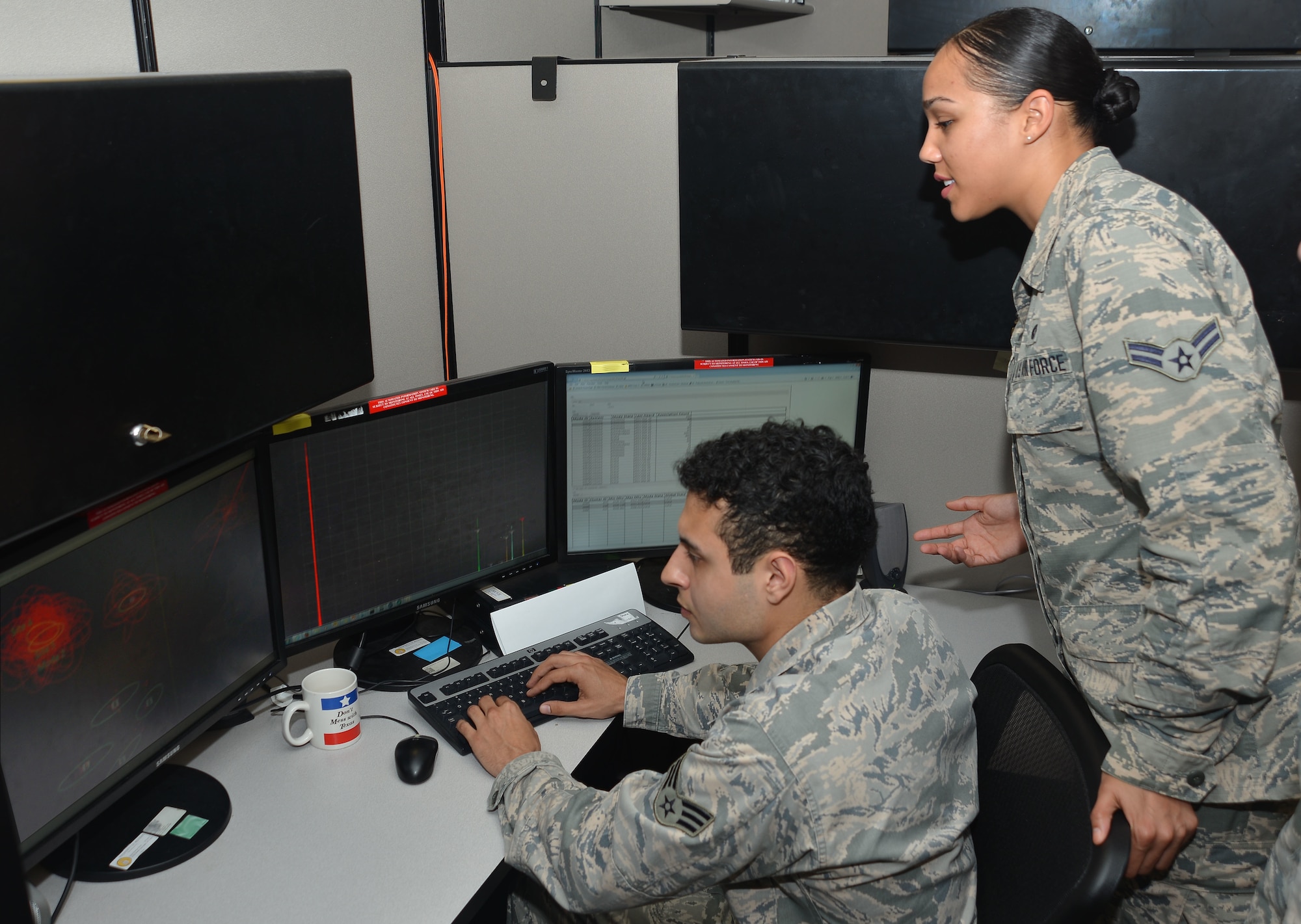 Analysts from the 453rd Electronic Warfare Squadron validate results from an automated flagging process called data-mining March 31, 2017, at Joint Base San Antonio-Lackland, Texas. Data-mining allows analysts to validate automated results rather than manually sifting through all the data.  (U.S. Air Force Photo by Lori Bultman/released)