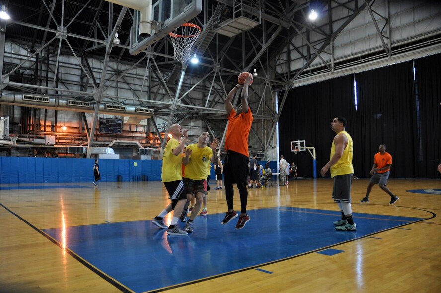 Tech. Sgt. Michael Shepherd, 445th Logistics Readiness Squadron, reaches for a shot during the second game of the March Mania Basketball Tournament March 4, 2017. The LRS ultimately walked away as champions of the event, having played in, and won, three out of the four games. (U.S. Air Force photo/Staff Sgt. Rachel Ingram)