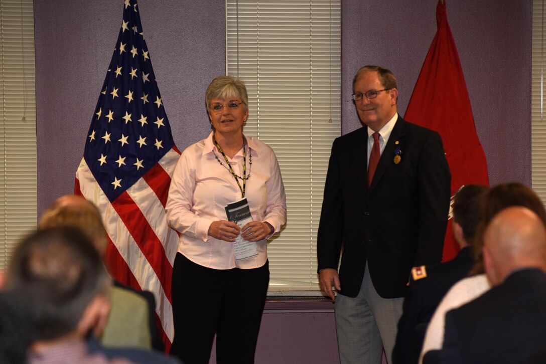 Patty Coffey presents the Tennessee Award of Merit from Gov. Bill Haslam to Mike Wilson, U.S. Army Corps of Engineers Nashville District deputy for Programs and Project Management at his retirement ceremony March 31, 2017 at the district headquarters in Nashville, Tenn. Wilson culminates 42 years of federal service. Coffey will serve in his position until a permanent replacement can be made in the future.