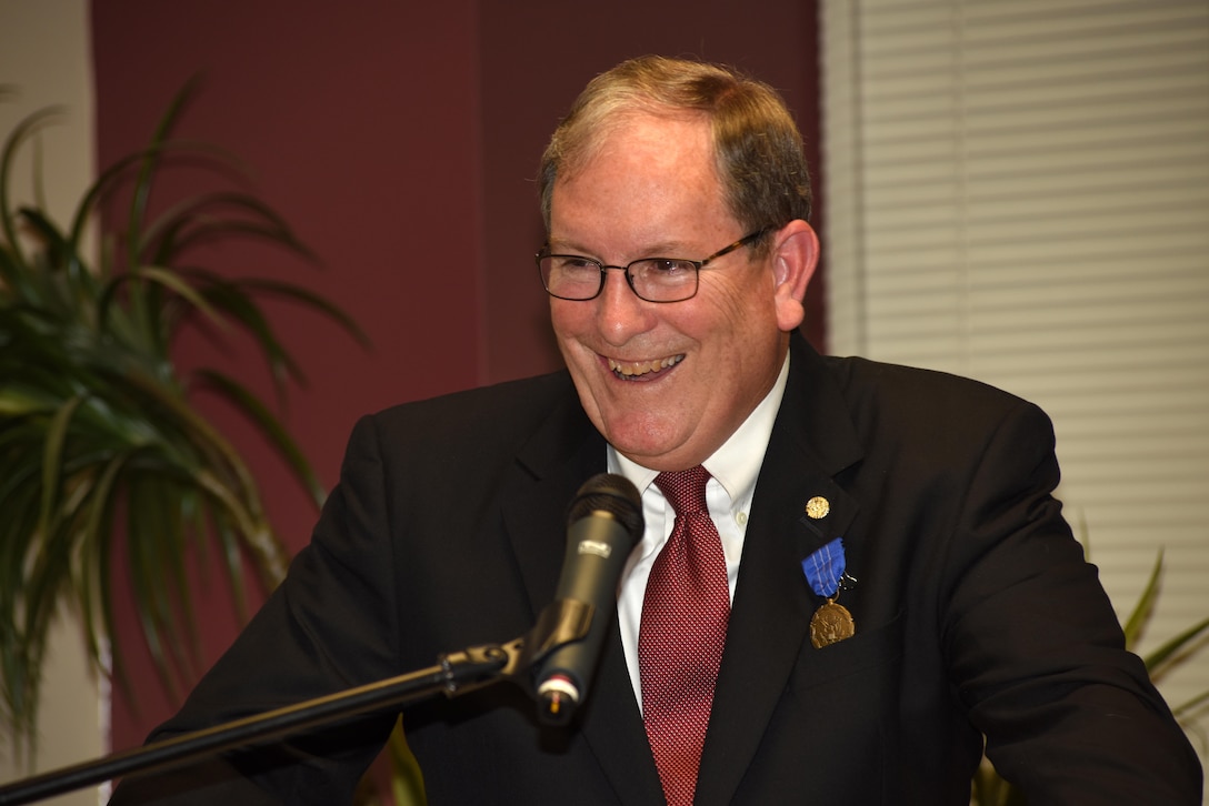 Mike Wilson, U.S. Army Corps of Engineers Nashville District deputy for Programs and Project Management, addresses more than 100 friends, acquaintances, family, and members of the U.S. Army Corps of Engineers Nashville District at the conclusion of his retirement ceremony at the district headquarters in Nashville, Tenn., March 31, 2017. Wilson is wearing the Department of the Army Meritorious Civilian Service Award for his distinguished service to the nation during 42 years of federal service.