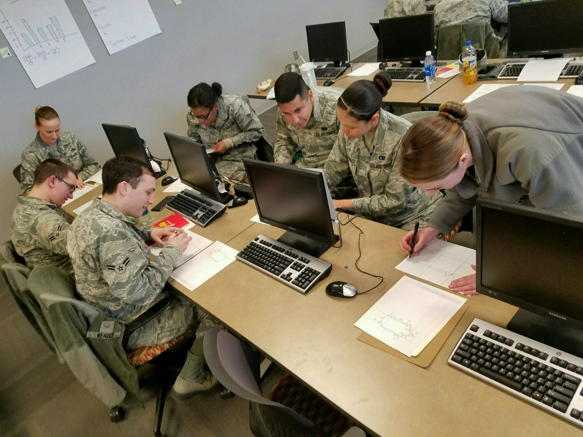 Airmen participate in a group exercise for a Continuous Process Improvement course in the installation deployment center at Ellsworth Air Force Base, S.D., January 31, 2017. CPI is the strategic refinement of the way servicemembers, Department of Defense civilian and contractors perform tasks to accomplish the Air Force mission. (Courtesy photo)