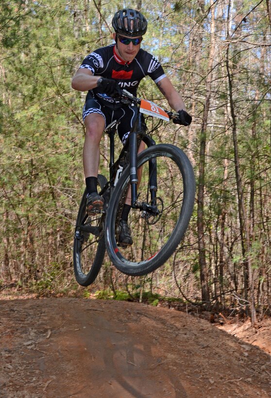 A mountain bicyclist goes airborne during the Six Hours of Warrior Creek mountain bike race at the Wilmington District's W. Kerr Scott Dam and Reservoir in Wilkesboro, N.C. (See article below. File photo by Hank Heusinkveld) 