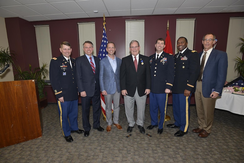 Nashville District commanders (Left to right) Col. John L. Hudson, National War College; U.S. Army, retired Col. Bernard R. Lindstrom; Col. James A. DeLapp, U.S. Army Corps of Engineers Mobile District commander; retiree Mike Wilson, U.S. Army Corps of Engineers Nashville District deputy for Programs and Project Management;  Lt. Col. Stephen F. Murphy, Nashville District commander; Col. Anthony P. Mitchell, St. Louis District commander and retired Colonel and U.S. Army Corps of Engineers Mobile District deputy for Programs and Project Management, Peter F. Taylor Jr.; pose together at Wilson's retirement at the Estes Kefauver Federal Building in Nashville, Tenn., March 31, 2017. 