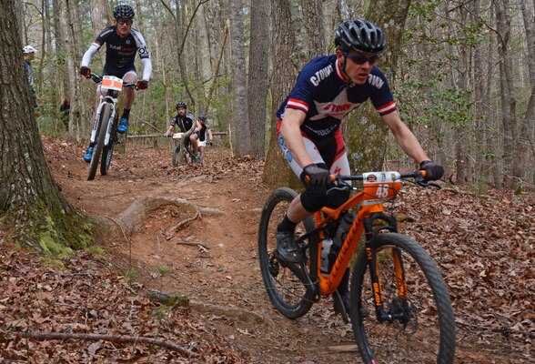 Mountain bicyclists hit a narrow stretch of the trail during the Six Hours of Warrior Creek mountain bike race at the Wilmington District's W. Kerr Scott Dam and Reservoir in Wilkesboro, N.C. (File photo by Hank Heusinkveld) 