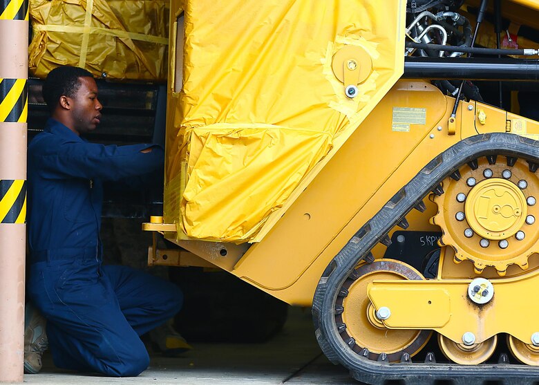 Senior Airman Dexter Alleyne, 445th Logistics Readiness Squadron, prepares a track loader to be painted while performing his annual tour here March 13, 2017. The paint is used as corrosion control due to the regions humid weather.(U.S. Air Force photo/Tech. Sgt. Patrick O’Reilly)