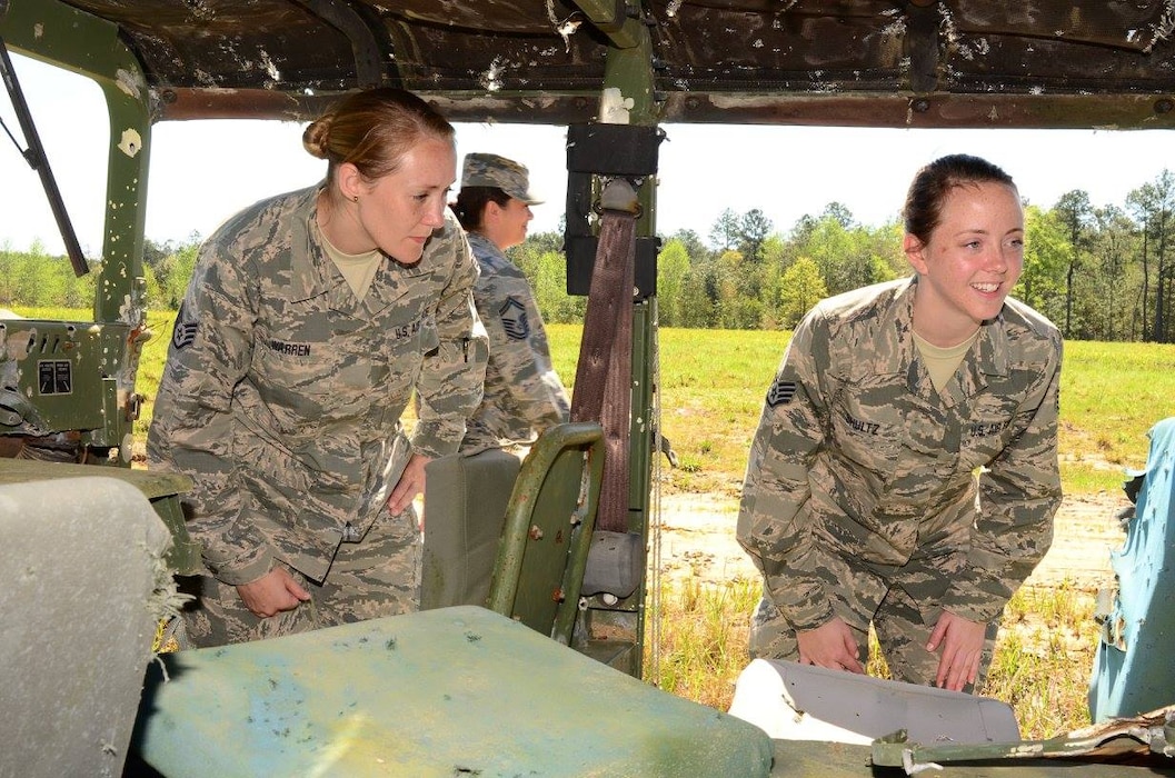 Technical Sgt. Jennifer Warren (left) and Staff Sgt. Kristen Schultz, 172d Airlift Wing, view the inside of a jeep that has been used for target practice at Camp Shelby Joint Forces Training Center's air to ground range. The Mississippi Air National Guardsmen were participating in the state’s junior NCO orientation trip that enabled them to see the type of Air National Guard training that is conducted at the training site. 