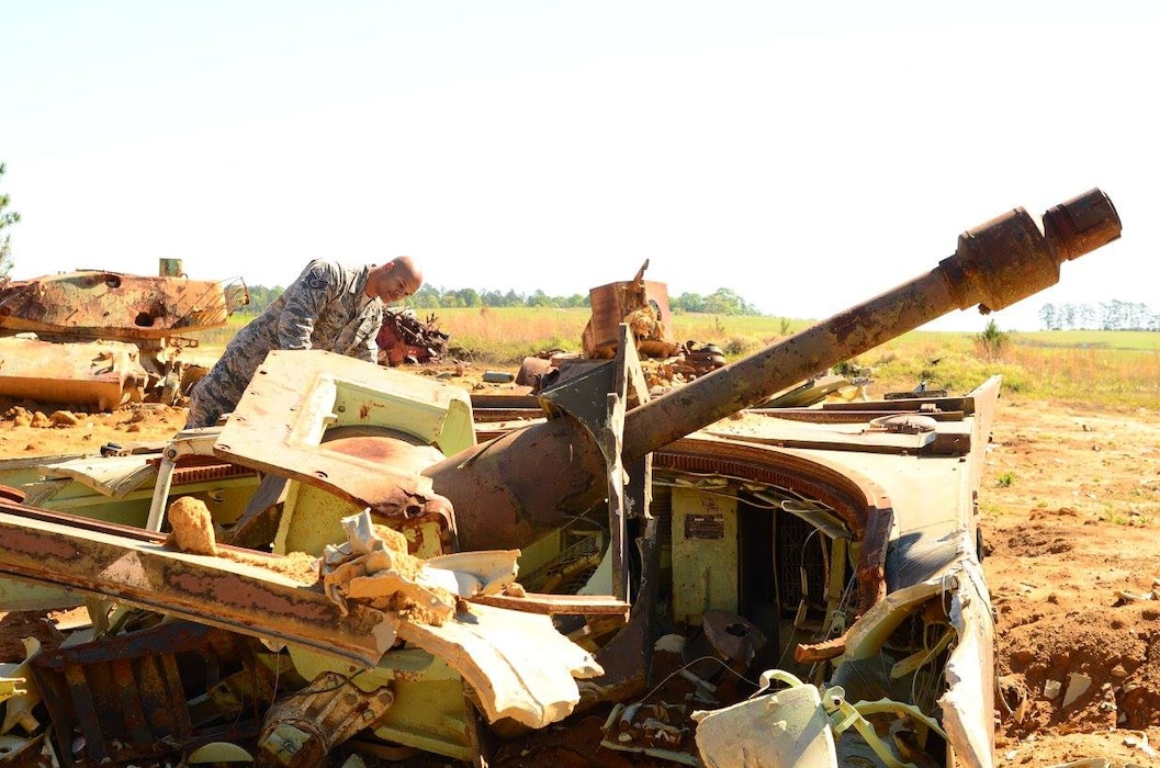 Technical Sgt. Chigbo Nzoiwu, 172d AW, views a destroyed target at Camp Shelby's air-to-ground range. The Guardsmen were participating in the state’s junior NCO orientation trip that enabled them to see the type of Air National Guard training that is conducted at the training site. 
