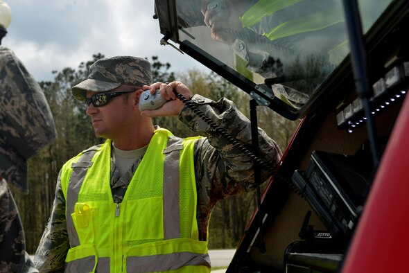 U.S. Air Force Tech. Sgt. Brian Ficzner, 20th Civil Engineer Squadron assistant operations chief, talks over a radio during a major accident response exercise in Sumter, S.C., March 30, 2017. The exercise tested the coordination between Sumter and Shaw Air Force Base, S.C., responders in the event of an aircraft mishap. (U.S. Air Force photo by Airman 1st Class Destinee Sweeney)