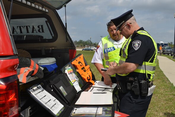Local responders coordinate outside the scene of a major accident response exercise in Sumter S.C., March 30, 2017. The exercise simulated a downed aircraft, presenting various hazards which local and base responders worked together to conquer. (U.S. Air Force photo by Airman 1st Class Destinee Sweeney)