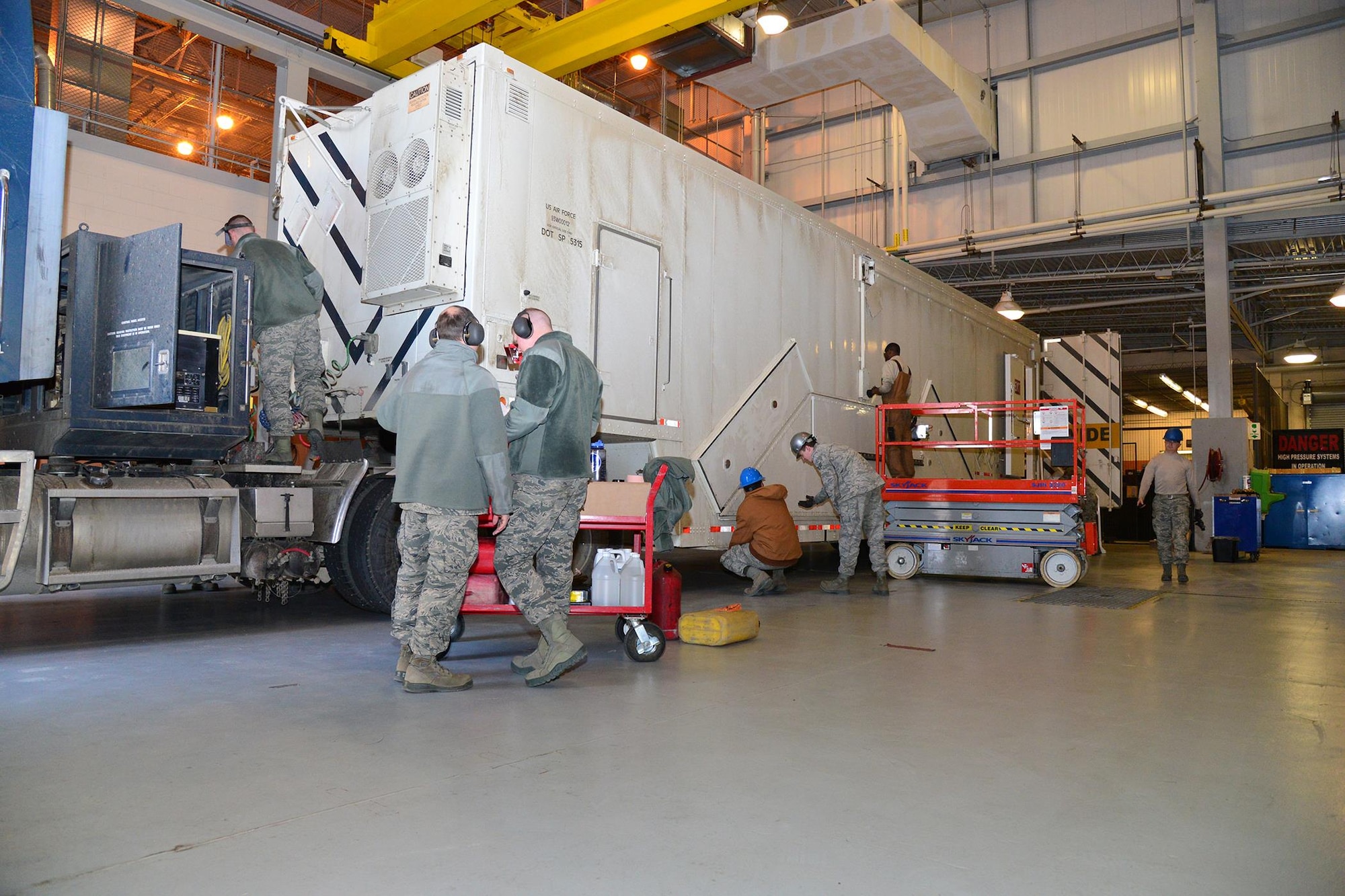 Airmen from the 341st Missile Maintenance Squadron perform maintenance on a payload transporter Feb. 8, 2016, at Malmstrom Air Force Base, Mont. The 341st MMXS is one of many teams that contributed toward the 341st Maintenance Group 2016 Air Force Maintenance Effectiveness Award. (U.S. Air Force photo/Airman First Class Daniel Brosam)