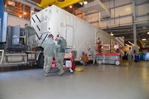 Airmen from the 341st Missile Maintenance Squadron perform maintenance on a payload transporter Feb. 8, 2016, at Malmstrom Air Force Base, Mont. The 341st MMXS is one of many teams that contributed toward the 341st Maintenance Group 2016 Air Force Maintenance Effectiveness Award. (U.S. Air Force photo/Airman First Class Daniel Brosam)