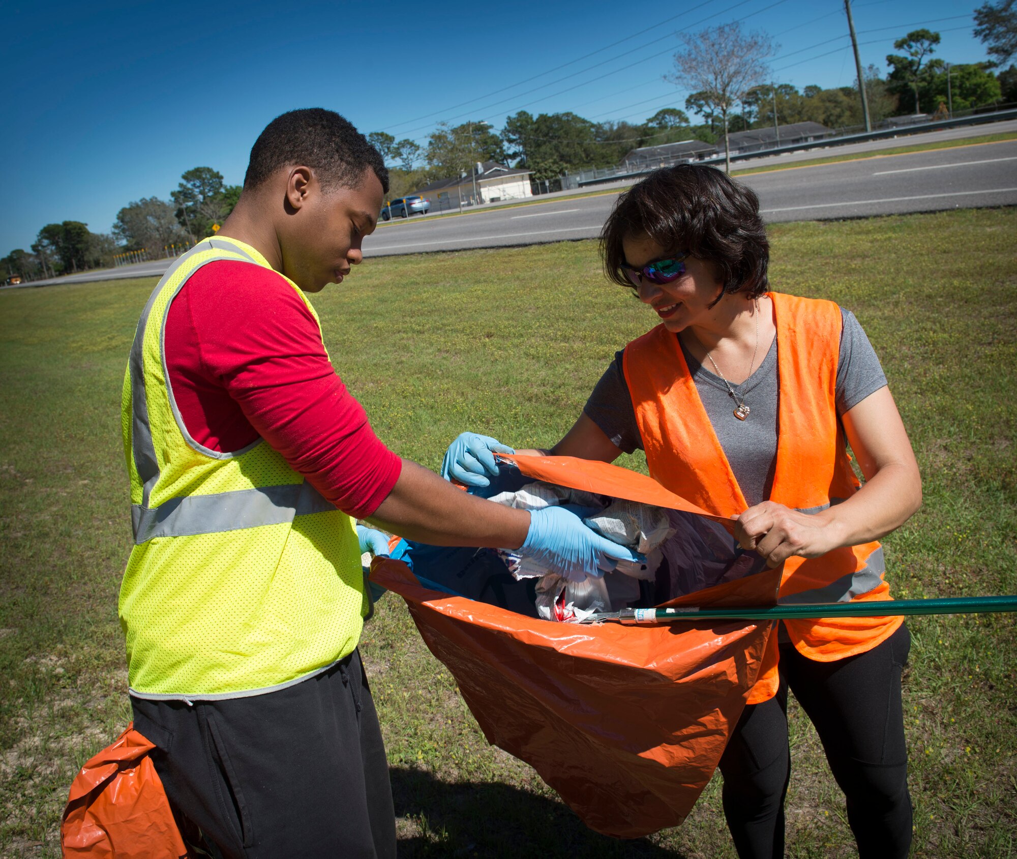 Air Commandos with the 1st Special Operations Support Squadron collect trash during a highway-cleanup event in Fort Walton Beach, Fla., March 31, 2017. The Air Commandos with the 1st SOSS cover a 2.4-mile stretch of highway quarterly picking up trash in an effort to help keep Florida beautiful.  (U.S. Air Force photo by Senior Airman Krystal M. Garrett) 