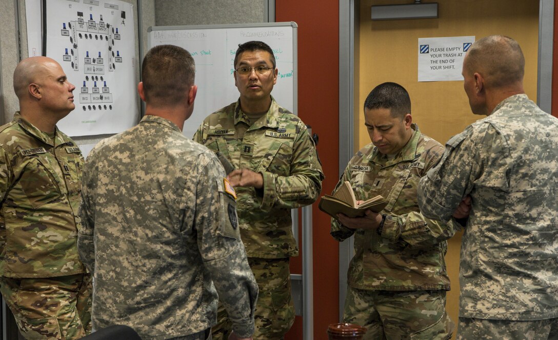 The 317th Military Police Battalion from Tampa, Fla., participate in the Defense Support of Civilian Authority (DSCA) training exercise ‘Vigilant Guard’ from March 27 to April 2, 2017 at Fort Stewart, Ga. Capt. Winston Holyan and 1st Lt. Tony David Garcia with the 266th Military Police Battalion in the New Mexico National Guard receive tips on executing a Defense Support of Civil Authority (DSCA) training exercise. (U.S. Army Reserve photo by Sgt. Elizabeth Taylor)