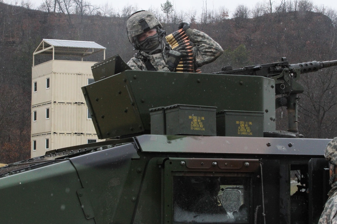 U.S. Army Reserve Sgt. Phillip McCaffrey, 238th Transportation Company (Improved Cargo Handling Operations), 79th Sustainment Support Command, hoists  ammunition over his shoulder in preparation for qualification live-fire during Operation Cold Steel at Fort McCoy, Wis., April 3, 2017. Operation Cold Steel is the U.S. Army Reserve's crew-served weapons qualification and validation exercise to ensure that America's Army Reserve units and Soldiers are trained and ready to deploy on short-notice and bring combat-ready and lethal firepower in support of the Army and our joint partners anywhere in the world. (U.S. Army Reserve photo by Staff Sgt. Debralee Best, 84th Training Command)