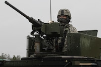 U.S. Army Reserve Sgt. Phillip McCaffrey, 238th Transportation Company (Improved Cargo Handling Operations), 79th Sustainment Support Command, steadies a M2 .50 caliber machine gun while riding to the staging line for qualification live-fire during Operation Cold Steel at Fort McCoy, Wis., April 3, 2017. Operation Cold Steel is the U.S. Army Reserve's crew-served weapons qualification and validation exercise to ensure that America's Army Reserve units and Soldiers are trained and ready to deploy on short-notice and bring combat-ready and lethal firepower in support of the Army and our joint partners anywhere in the world. (U.S. Army Reserve photo by Staff Sgt. Debralee Best, 84th Training Command)