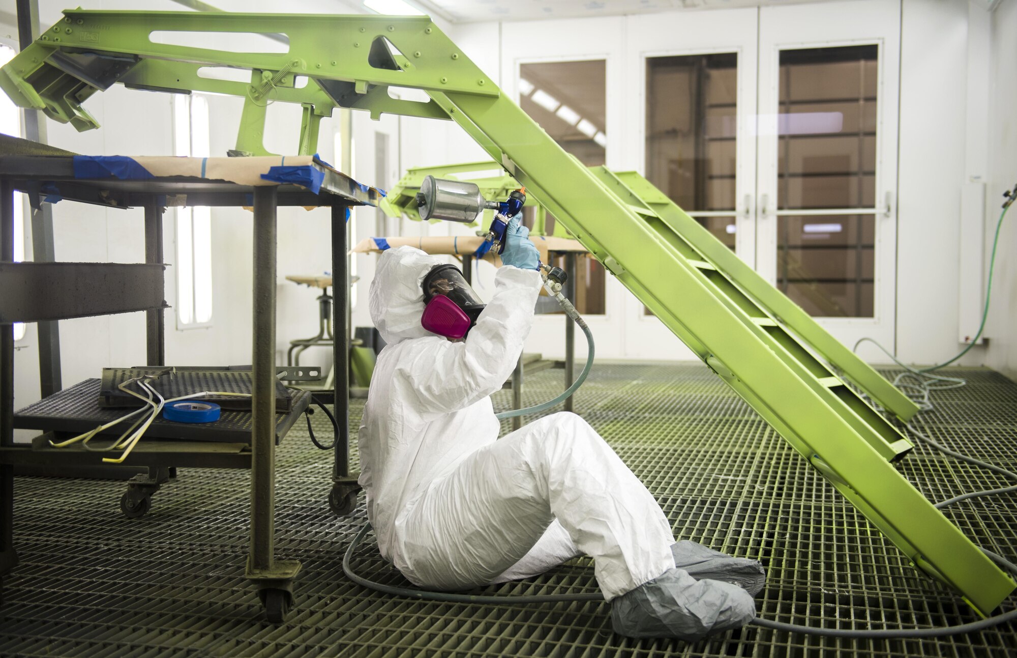 Airman 1st Class Brittney Taylor, 113th Maintenance Squadron aircraft structural maintenance apprentice, sprays grey paint onto an F-16 Fighting Falcon cockpit ladder at Joint Base Andrews, Md., March 27, 2017. Structural maintenance Airmen ensure the aircraft is mechanically sound so the D.C. Air National Guard’s mission runs smoothly. (U.S. Air Force photo by Airman 1st Class Gabrielle Spalding) 