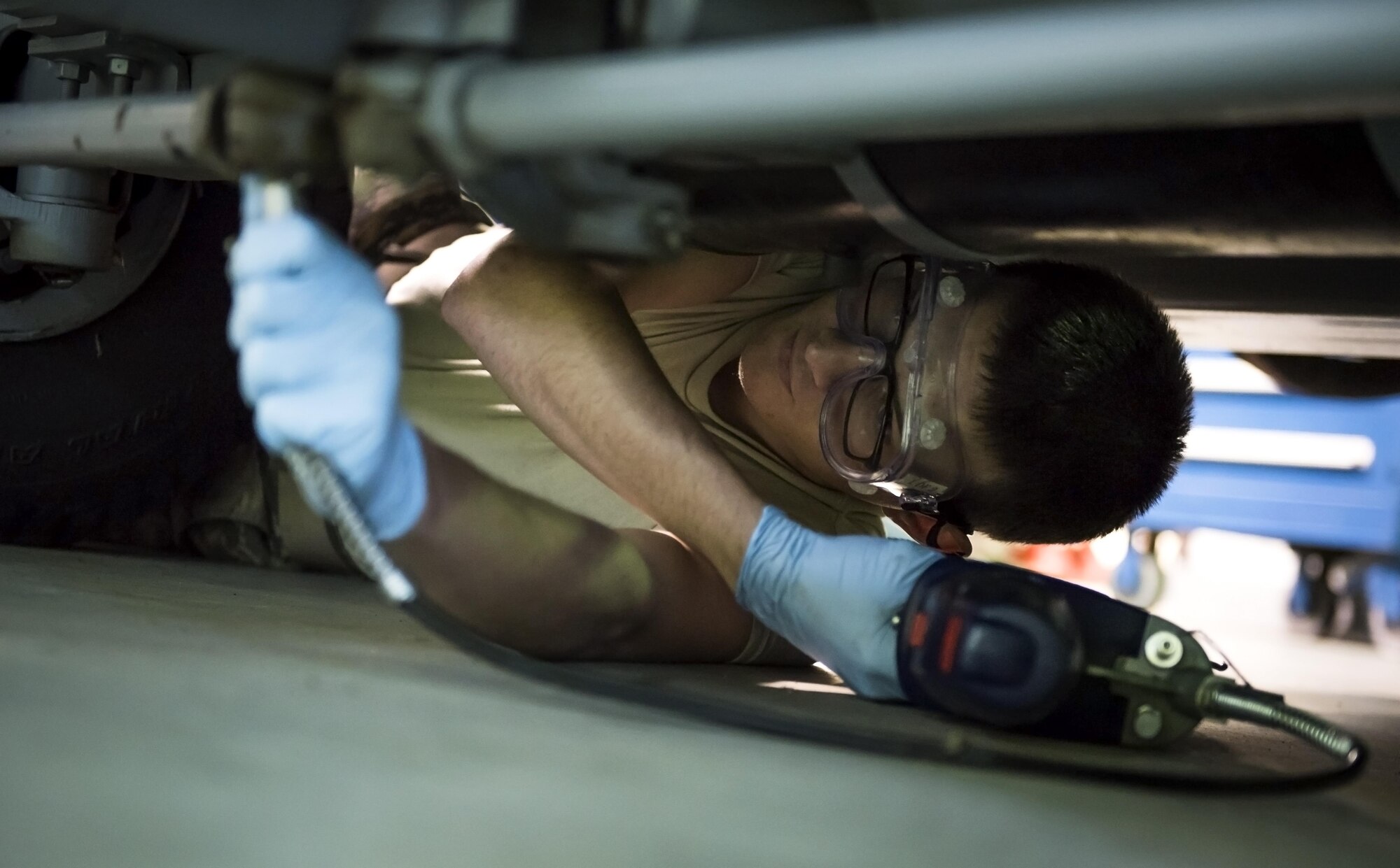 Airman 1st Class Jonathan Lake, 113th Maintenance Squadron aerospace ground equipment apprentice, tightens a bolt on an air conditioning unit at Joint Base Andrews, Md., March 27, 2017. The D.C. Air National Guard has various missions including defending the National Capital Region, supporting the District and local communities during special security events and natural disasters, and maintaining a worldwide deployable fighter and support force. (U.S. Air Force photo by Airman 1st Class Gabrielle Spalding)