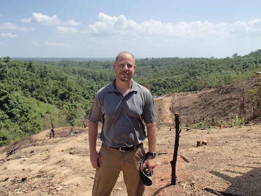 Matthew Grunewald, stands in the jungle base camp in the Quang Tri Province of Vietnam overlooking the excavation site. Grunewald, a Mobile District archeologist participated in a month-long Defense POW/MIA Accounting Agency mission in Vietnam, in an effort to recover military personnel lost during the Vietnam War. 