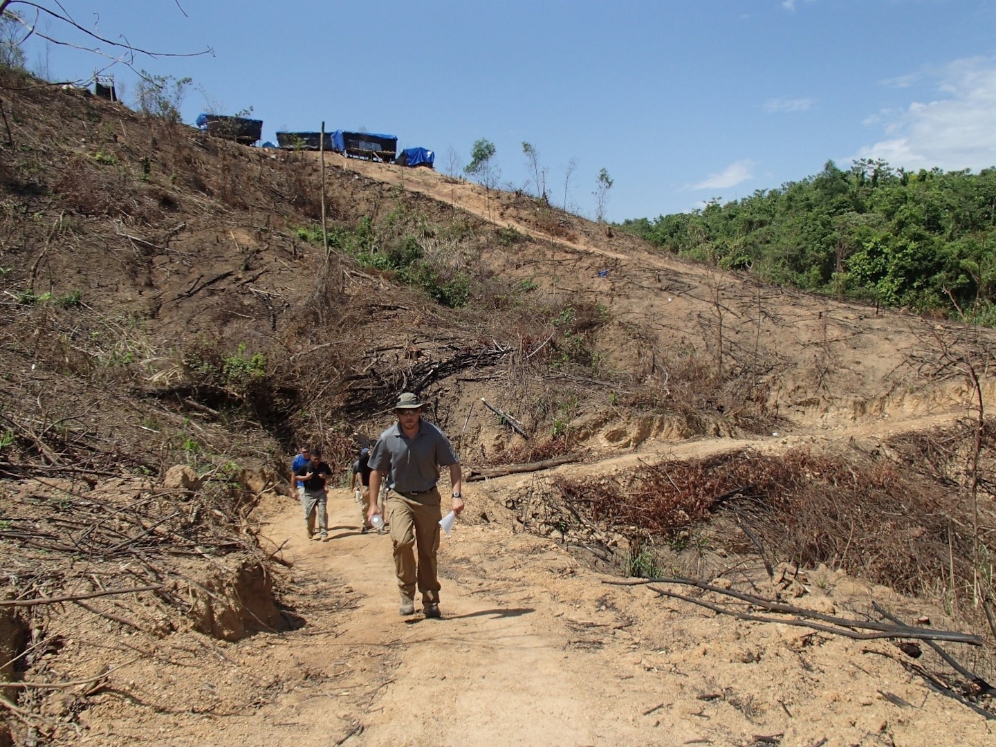 Grunewald hikes up to the excavation area from the base camp.