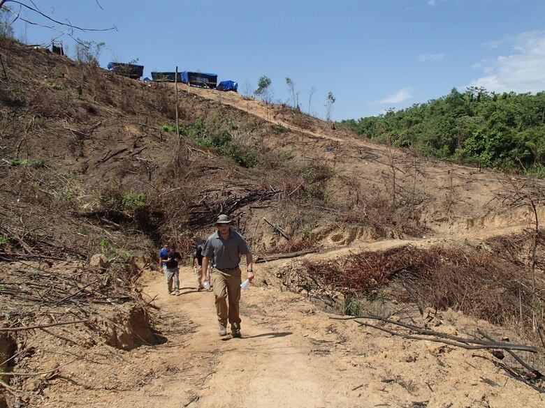 Grunewald hikes up to the excavation area from the base camp.