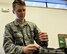 Airman 1st Class Sabatino DiMascio, 62nd Aircraft Maintenance Squadron communication/navigation mission systems specialist, performs functions checks on equipment March 29, 2017 on the flightline at McChord Field, Wash. While on duty, DiMascio works on electronics and avionics such as radios, GPS and anti-missile defense systems; off duty, he is a member of the pit-crew at a Washington speedway. (U.S. Air Force photo/Staff Sgt. Whitney Amstutz)  