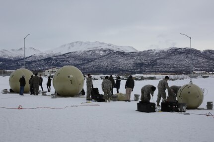 Soldiers from the 4th Infantry Brigade Combat Team (Airborne) 25th Infantry Division at Joint Base Elmendorf-Richardson, Alaska set up two "Heavy" systems on the left, and two "Lite" systems on the right, of the Transportable Tactical Command Communications (T2C2) system during new equipment training during February. The Soldiers then conducted a record test of the system during operational testing March 15 to 26. T2C2 is a new Army program of record that when fielded will provide agile robust voice and data communications in the early phases of joint operations and in later operational phases at the tactical edge.