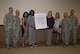 Members from the Sexual Assault Prevention and Response program and base leadership pose for a photo with a proclamation, March 20, 2017, at Moody Air Force Base, Ga. The proclamation was signed to declare the month of April 2017 as SAPR month for Team Moody. This year’s theme for SAPR month is “Protecting our people protects our mission.” (U.S. Air Force photo by Airman 1st Class Lauren M. Sprunk)