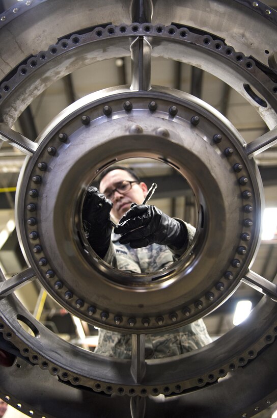 Staff Sgt. James Winn, 113th Maintenance Squadron aerospace propulsion technician, performs phase maintenance on the fan frame of an F-16 Fighting Falcon engine at Joint Base Andrews, Md., March 27, 2017. The F-16 must go through different inspections to ensure the quality and safety of the aircraft for mission readiness. In this case, the aerospace propulsion technicians are responsible for the tear down, inspection and build-up of F-16 engines after 4,000 flight hours. (U.S. Air Force photo by Airman 1st Class Gabrielle Spalding)