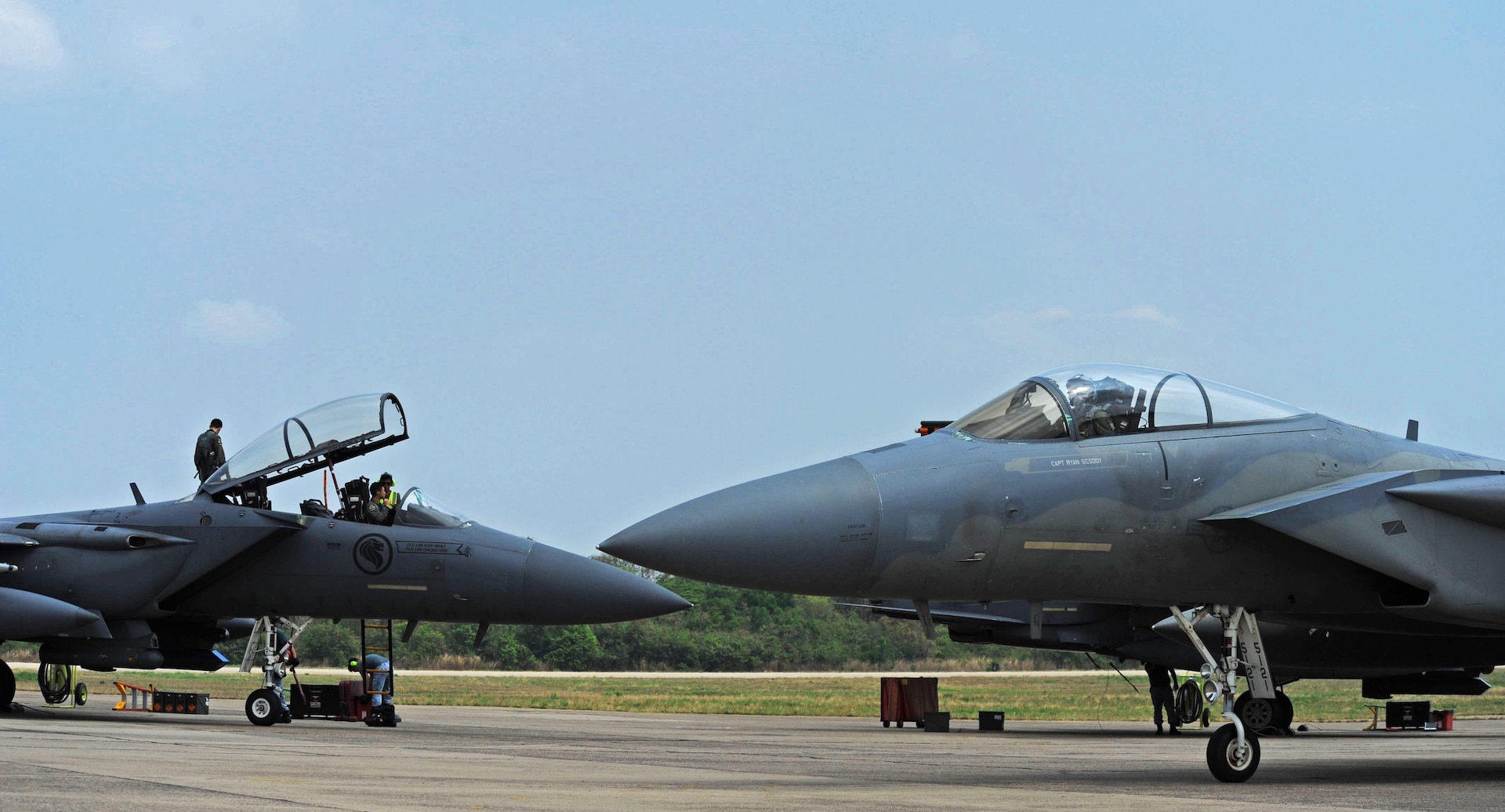 A U.S. Air Force F-15 (front) taxis past a Republic of Singapore air force F-15 during exercise Cope Tiger 17 at Korat Royal Thai Air Force Base, Thailand, March 24, 2017. The annual multilateral exercise, which involves a combined total of 76 aircraft and 43 air defense assets, is aimed at improving combined combat readiness and interoperability between the Republic of Singapore air force, Royal Thai air force, and U.S. Air Force, while concurrently enhancing the three nations' military relations. 