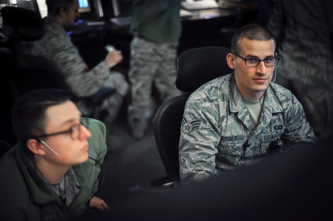 Senior Airman William Glessner, a 71st Operations Support Squadron RAPCON controller, provides guidance for student pilots flying in the skies over Oklahoma March 14. Glessner was a guest on the Clepper in the Morning show on FM 103.1 KOFM. 
