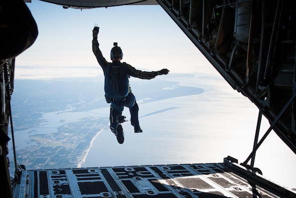 A member of the U.S. Navy Leap Frogs jumps from an 815th Airlift Squadron C-130J Super Hercules aircraft  April 4. The Leap Frogs coordinated with the Flying Jennies to complete this jump and several others out of Keesler Air Force Base, Mississippi as joint training for both groups, which was also in conjunction with Navy Week and the Mississippi bicentennial celebration. (U.S. Air Force photo/Staff Sgt. Heather Heiney)