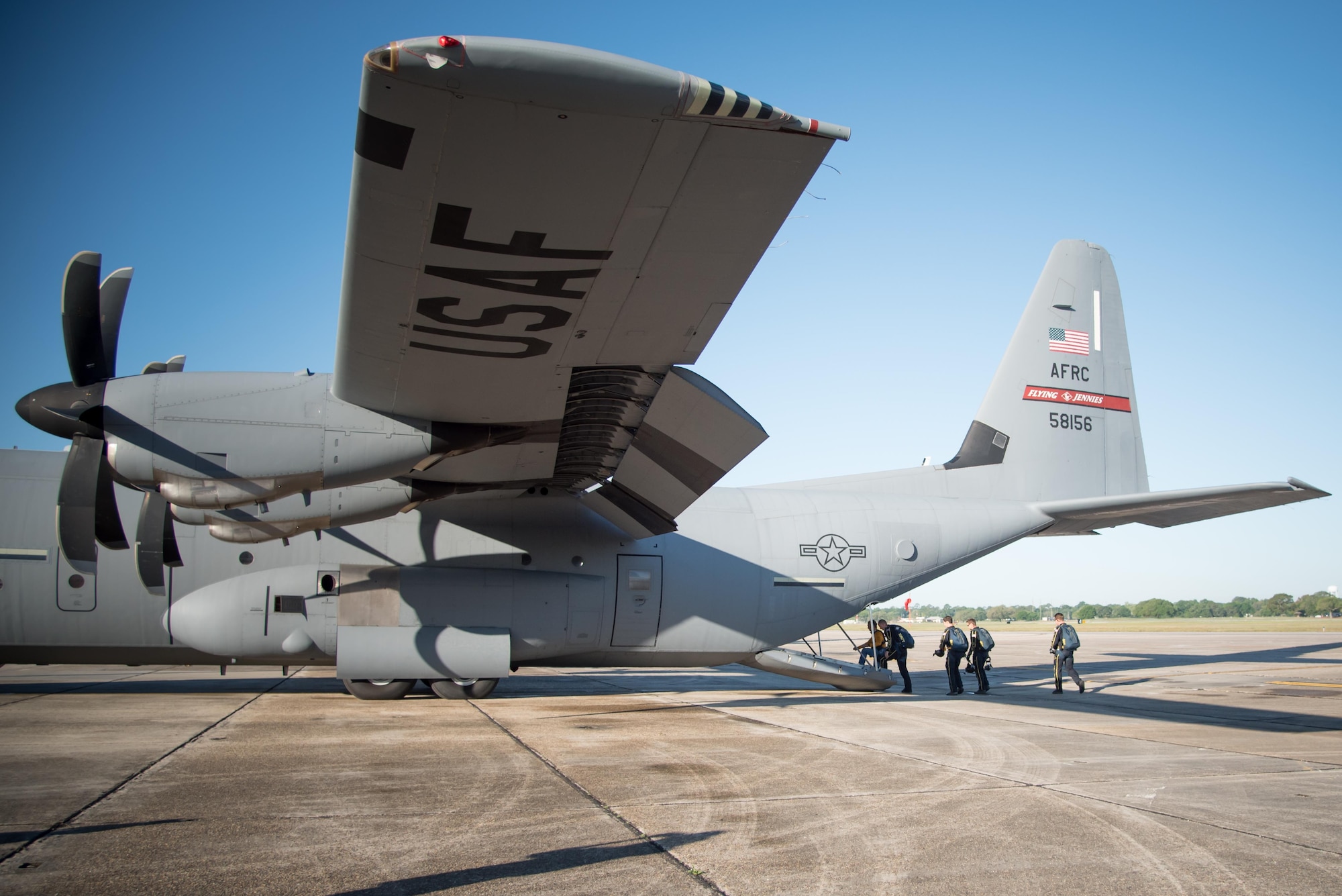 Members of the U.S. Navy Leap Frogs and Gulfport Mayor Billy Hewes board an 815th Airlift Squadron C-130J Super Hercules aircraft for a jump April 4 out of Keesler Air Force Base, Mississippi. The Leap Frogs coordinated with the Flying Jennies to complete this jump and several others as joint training for both groups, which was also in conjunction with Navy Week and the Mississippi bicentennial celebration.(U.S. Air Force photo/Staff Sgt. Heather Heiney)
