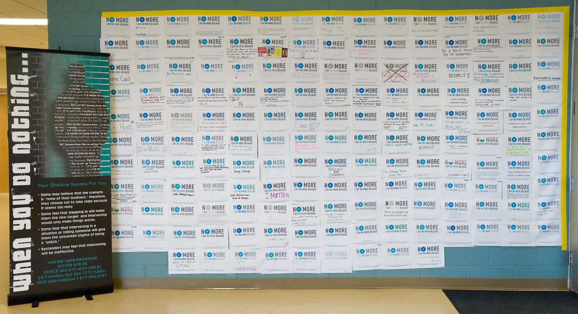 One hundred fifty-nine Sexual Assault Awareness Month campaign posters cover the graffiti wall March 31, 2017 at the Fitness Center on Dover Air Force Base, Del. Team Dover members wrote personal messages on their own poster to voice opinions and beliefs regarding the subject of sexual assault. (U.S. Air Force photo by Roland Balik)