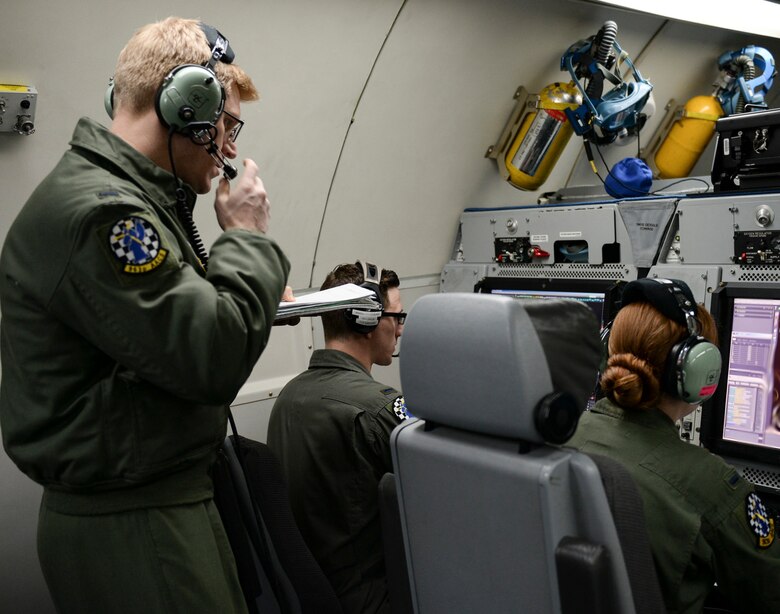 Members of the 963rd Airborne Air Control Squadron monitor air operations, March 15, while flying over the Pacific Northwest. The 963rd AACS is assigned to Tinker, and came to Mountain Home AFB to participate in the Gunfighter Flag exercise. (Air Force photo by Senior Airman Jessica H. Smith)