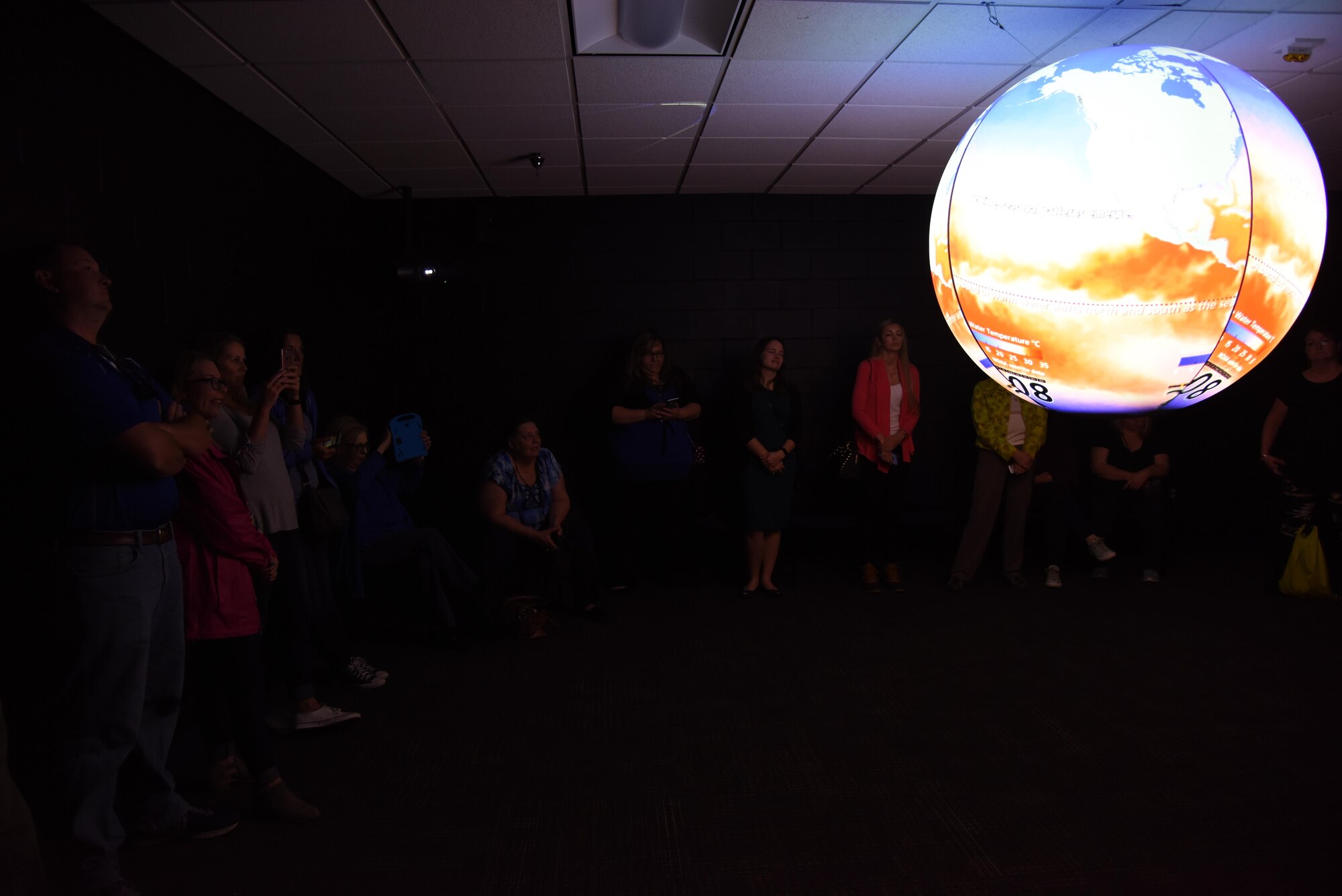 Educators receive a Science on a Sphere demonstration at the Weather Training Complex during a NASA Educator Workshop, March 30, 2017, on Keesler Air Force Base, Miss. NASA teamed up with 335th Training Squadron weather instructors and the 403rd Wing Hurricane Hunters to provide teachers from Mississippi and Louisiana with available resources, techniques and best practices for use in their classrooms. (U.S. Air Force photo by Kemberly Groue)
