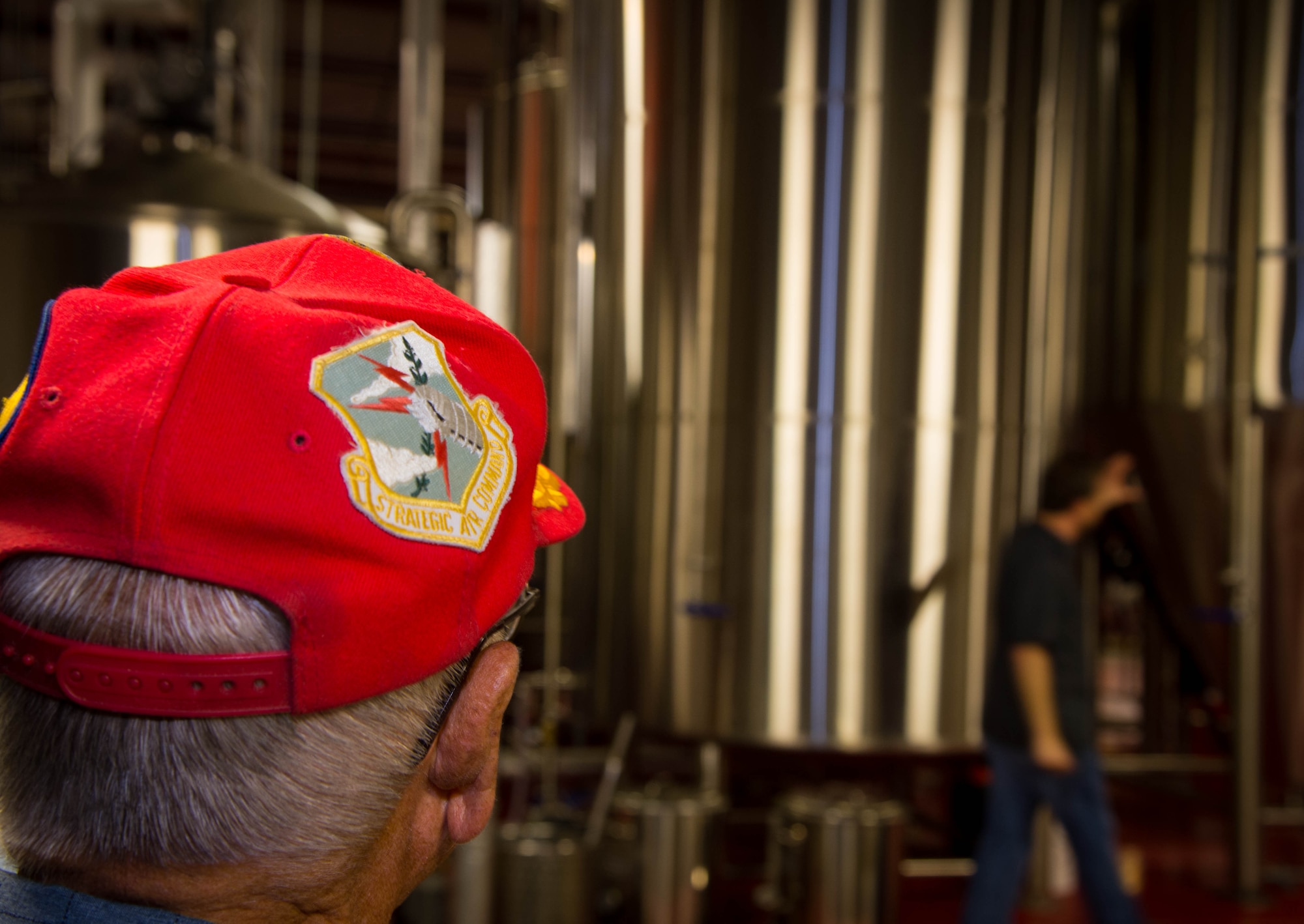A 307th Bomb Wing veteran, looks at storage tanks used for brewing beer at the Red River Brewing Co. Shreveport, La., March 30, 2017. The 307th Bomb Wing was originally under Strategic Air Command in 1954 at Lincoln Air Force Base, Nebraska. While at Lincoln, the 307th functioned as a Combat Ready Unit, conducting combat training missions and maintaining an alert force commitment, both at Lincoln and overseas bases, until its deactivation on March 25, 1965. (U.S. Air Force photo by Staff Sgt. Jason McCasland/Released)