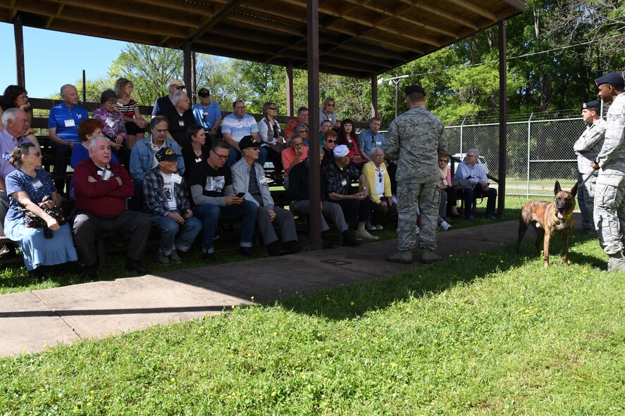 Airmen assigned to 2nd Bomb Wing Security Forces Squadron’s Military Working Dogs gave a demonstration of the dog’s abilities to alumni of the 307th BW during a base tour on Barksdale Air Force Base, La. March 31, 2017. The 307th BW hosted a reunion to celebrate the 75th anniversary of the unit and included alumni from wars such as World War II, the Korean War, Vietnam and the Cold War. (U.S. Air Force photo by Staff Sgt. Callie Ware/Released)