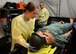 Capt. Kristian O’ Keefe, 56th Medical Support Squadron registered nurse, stabilizes the head of an injured dummy during the emergency trauma tent simulation March 23, 2017, at the Scottsdale Healthcare Military Training Center in Scottsdale, Ariz. The emergency trauma tent simulation provides the experience needed to perform successfully in combat and humanitarian missions. (U.S. Air Force photo by Airman 1st Class Alexander Cook)