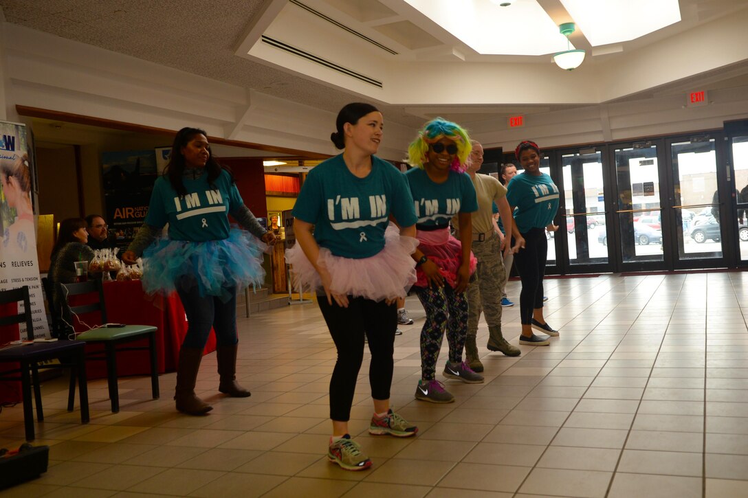 Sexual Assault Awareness and Prevention Month volunteers participate in a flash mob at the Base Exchange at Ellsworth Air Force Base, S.D., March 31, 2017. The Sexual Assault Response Coordinator planned several events throughout the month of April that focuses on sexual assault prevention and challenging gender-roles. (U.S. Air Force Photo by Airman Nicolas Z. Erwin)