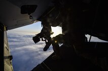 A special missions aviator with the 8th Special Operations Squadron, scans the horizon from a CV-22 Osprey over Northwest Florida, April 3, 2017. The aircrew visited Duke Field to utilize a Landing Helicopter Deck as part of a pre-deployment requirement for CV-22 aircrew to be deck qualified. The LHD will serve as part of the aircraft carrier qualification, decreasing the amount of time 8th SOS and 8th Aircraft Maintenance Unit personnel spend off station to fulfill the requirement.(U.S. Air Force photo by Airman 1st Class Joseph Pick)