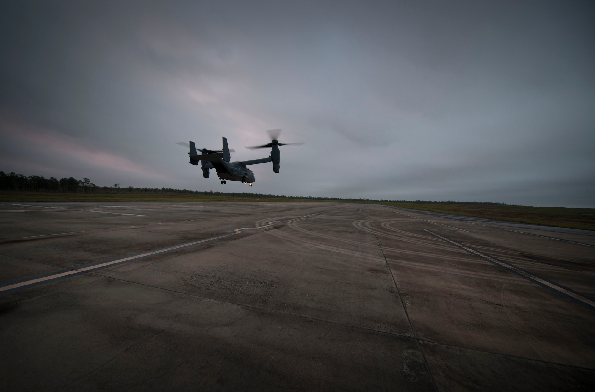 A CV-22 Osprey descends on the Landing Helicopter Deck at Duke Field, Fla., April 3, 2017. This was the first step in an effort to utilize the LHD as part of a pre-deployment requirement for CV-22 aircrew to be deck qualified. In previous years, members of the 8th Special Operations Squadron and 8th Aircraft Maintenance Unit would travel to various locations multiple times a year to gain aircraft carrier qualification.  (U.S. Air Force photo by Senior Airman Krystal M. Garrett)